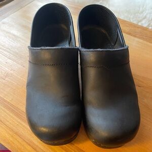 Dansko black leather clogs